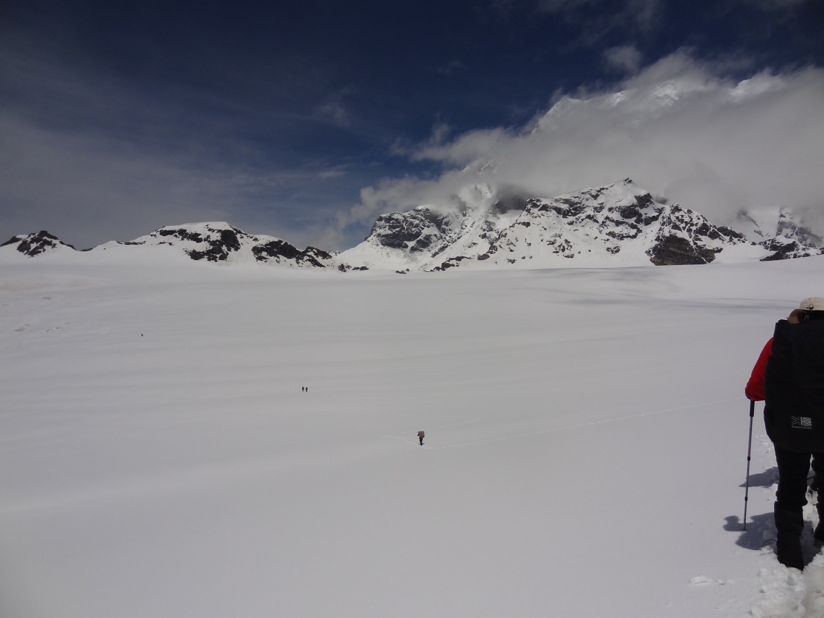 Panpatia Snowfield with Mt. Chaukhamba peeping through clouds