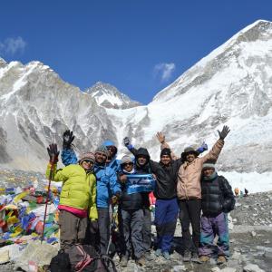 Group at the Everest Base Camp with the mountain itself in the background. 