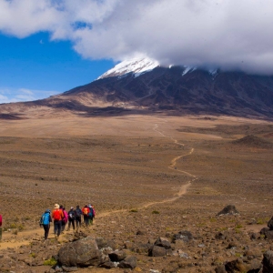 Walking towards Kilimanjaro, the mountain covered in the clouds!