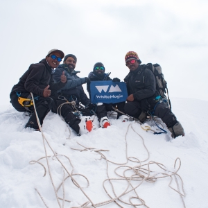 All smiles at the top! Our guides Sanjiv Rai and Ming Temba Sherpa on either side